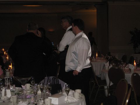 1988 Ford Bronco - A formal event with people mingling around decorated tables.