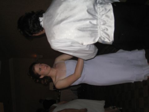 1988 Ford Bronco - A couple in wedding attire is captured in a moment, possibly during a reception or ceremony.