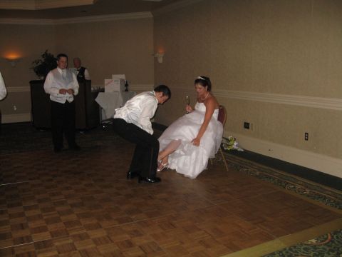 1988 Ford Bronco - Wedding reception event with groom removing bride's garter.