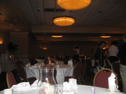 1988 Ford Bronco - A reception hall is set up for an event with tables, chairs, and decorative lighting.