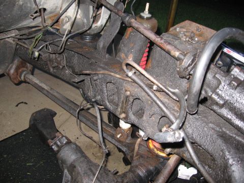 1974 Ford F-100 - Undercarriage view of a truck's frame and suspension system, showing various mechanical components and wiring.