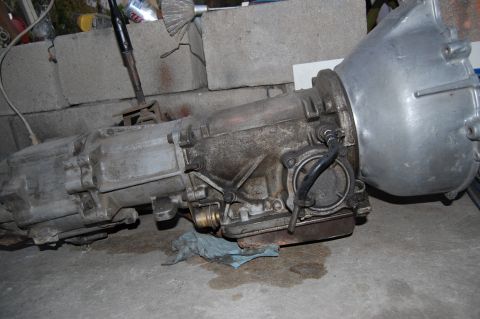 1992 Ford Explorer - Automatic transmission unit shown resting on a concrete floor with some fluid stains.