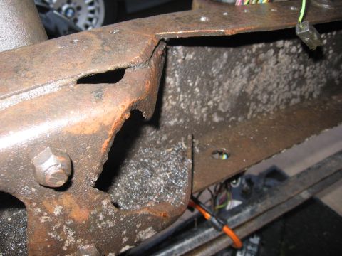 1974 Ford F-100 - Rusted truck frame section with wiring visible, likely from a cab swap project.