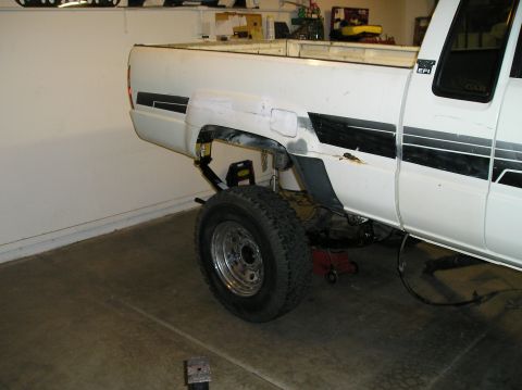1986 Toyota Hilux - Rear suspension work on a 1986 Toyota Hilux pickup truck.