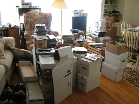 1988 Mercury Grand Marquis - A room is filled with boxes and furniture, suggesting a storage or moving situation.