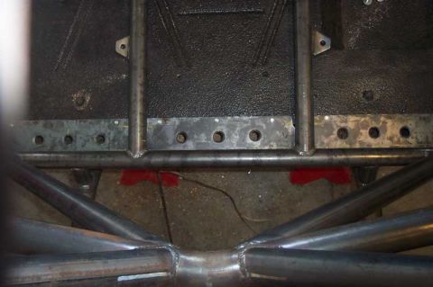 1992 Ford Mustang - Close-up view of the underbody chassis and roll cage tubing, showing fabrication details.