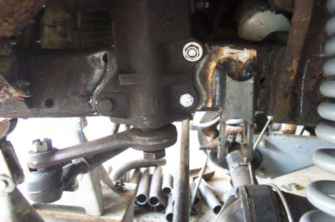 1992 Ford Mustang - Steering box and tie rod end assembly shown during vehicle repair or modification.