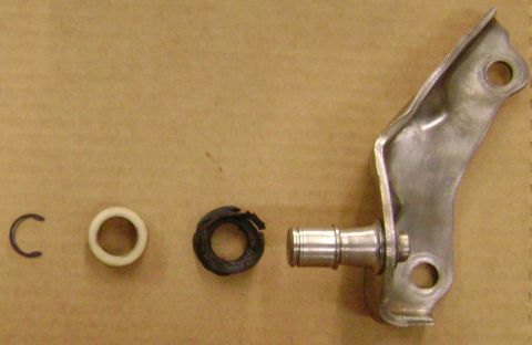 1972 Ford Ranchero - Metal bracket and associated rings on a brown background.