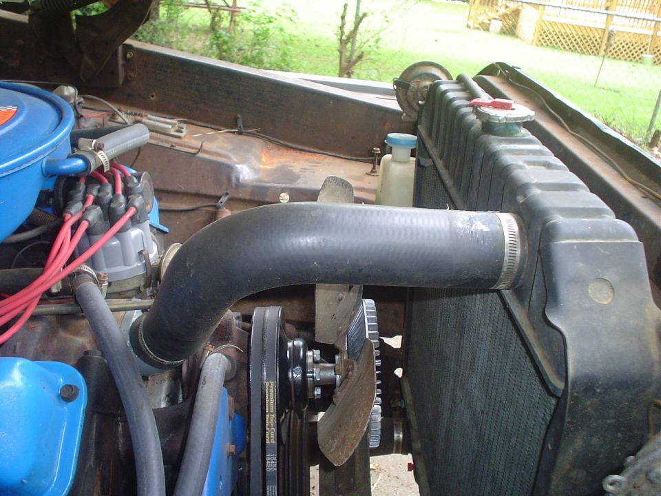 1967 Ford F-250 engine bay showing radiator, fan, and distributor
