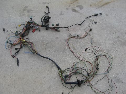 1974 Ford F-100 - This is a complex vehicle wiring harness, likely for an older model, laid out on a concrete surface.