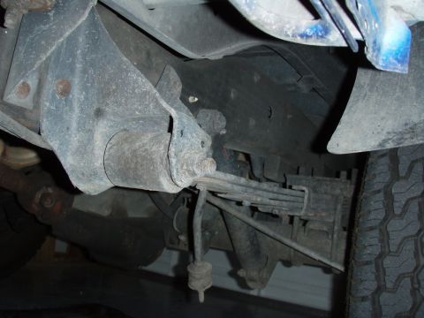 1996 Ford Bronco - The rear undercarriage of a 1996 Ford Bronco is visible, showing suspension components.
