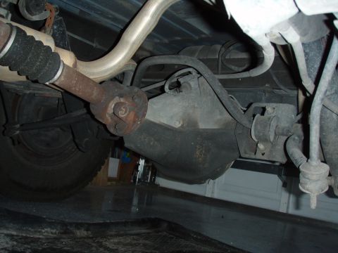1996 Ford Bronco - Undercarriage view showing the rear differential and driveshaft assembly.