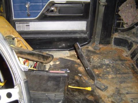 1979 Ford Bronco - Interior view of a 1979 Ford Bronco, highlighting the floor and door panel during restoration.