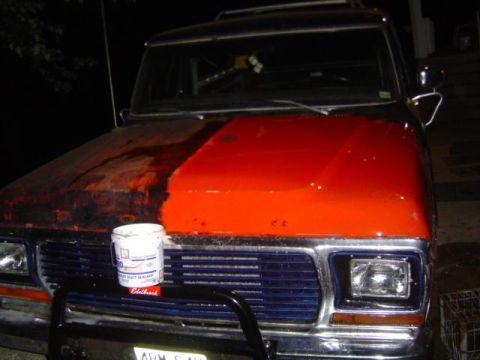 1979 Ford Bronco - A 1978 Ford Bronco shows a stark contrast between its rusted and freshly painted hood.
