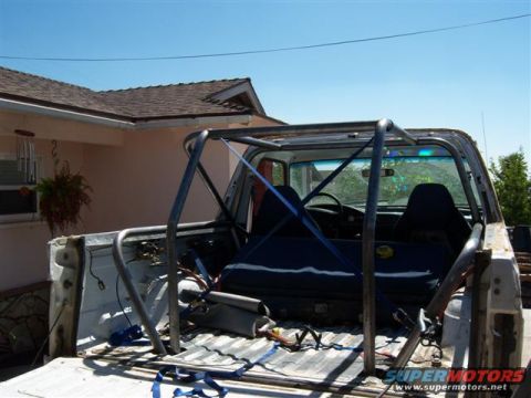 1996 Ford Bronco - Interior view of a 1996 Ford Bronco with a custom roll cage installed.
