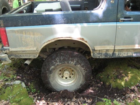 1991 Ford Bronco - This 1991 Ford Bronco is stuck in the mud off-road.