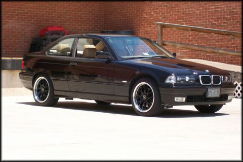 1998 BMW 3 Series - This black 1998 BMW 3 Series coupe features aftermarket wheels and a tan interior.