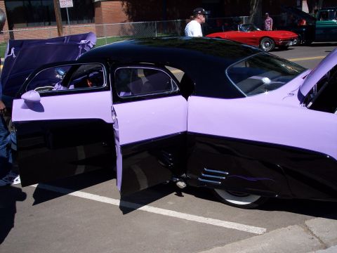 1972 Ford Ranchero - A customized coupe with its doors and hood open, parked outdoors with other vehicles nearby.