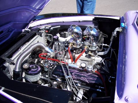 1972 Ford Ranchero - Customized engine bay dual carburetors and vibrant purple paint on the fender.