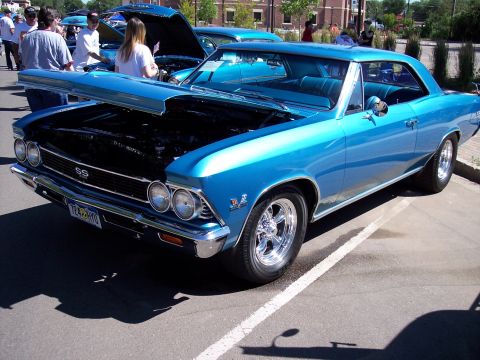1972 Ford Ranchero - A bright blue 1966 Chevrolet Chevelle SS coupe is displayed with its hood open at an outdoor event.