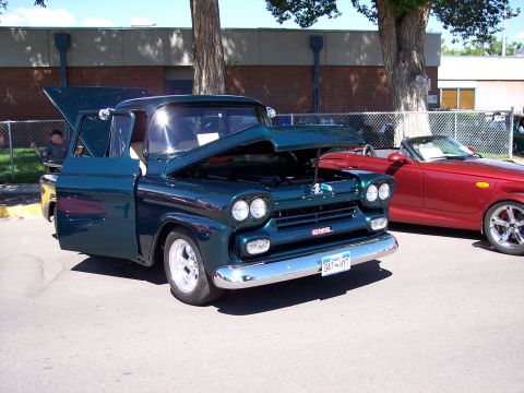 1972 Ford Ranchero - 1959 GMC pickup truck displayed with its hood and door open, alongside a red convertible.