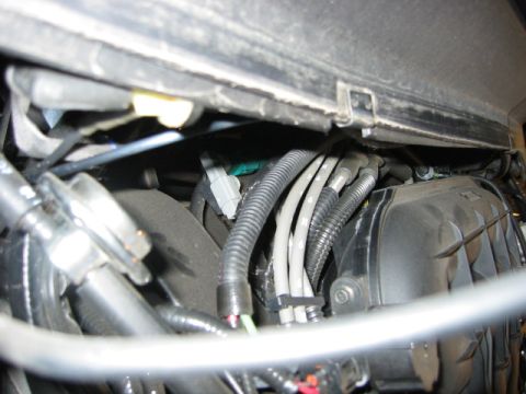 2002 Mercury Sable - A view of the complex wiring and components within a vehicle's engine compartment.