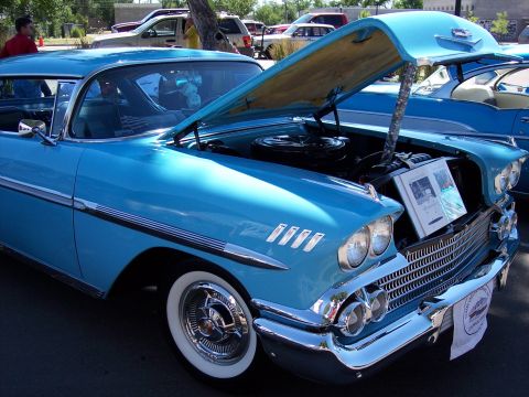 1972 Ford Ranchero - 1958 Chevrolet Impala on display, hood raised to reveal the engine compartment.