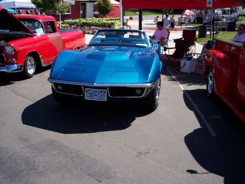 1972 Ford Ranchero - A blue 1969 Corvette convertible is parked at an outdoor event with other vehicles.