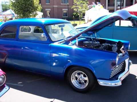 1972 Ford Ranchero - A blue coupe with its hood open, displaying its engine and chrome wheels.
