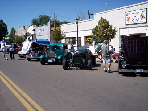 1972 Ford Ranchero - Vintage cars displayed on a street during a sunny day event.