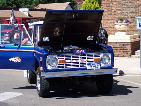 1972 Ford Ranchero - Blue 1970s Ford Bronco, hood open, showing engine and Denver Broncos livery.