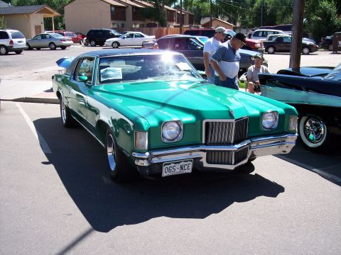 1972 Ford Ranchero - This green coupe with a black vinyl top features a prominent chrome grille and a Colorado license plate reading 065-NCE.