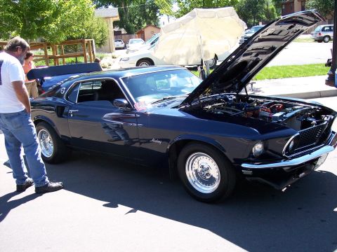 1972 Ford Ranchero - A dark blue 1969 coupe is displayed with its hood open, revealing the engine compartment.