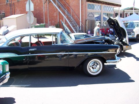 1972 Ford Ranchero - Side view of a classic 1957 Chevrolet Bel Air coupe at an outdoor car show.