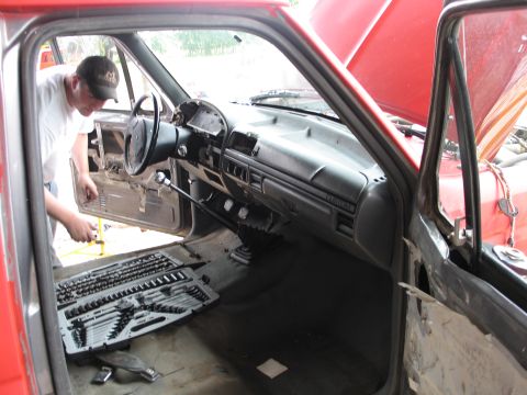 1995 Ford Bronco - Interior view of a 1995 Ford Bronco undergoing repairs, with tools laid out.