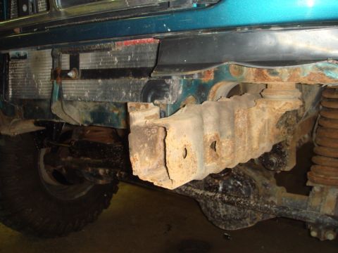 1996 Ford Bronco - The vehicle's front suspension and frame show significant rust, suggesting an older model than claimed.