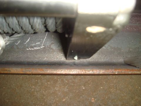1996 Ford Bronco - Close-up view of a winch cable and its metal mounting frame.