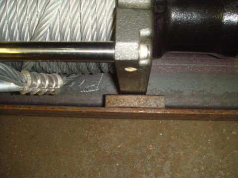 1996 Ford Bronco - Close-up view of a winch mechanism, showing the cable drum and mounting hardware.