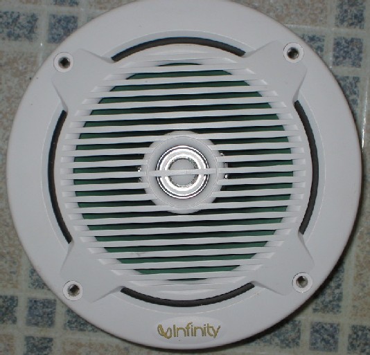 White Infinity marine coaxial speaker with slotted grille and chrome center tweeter