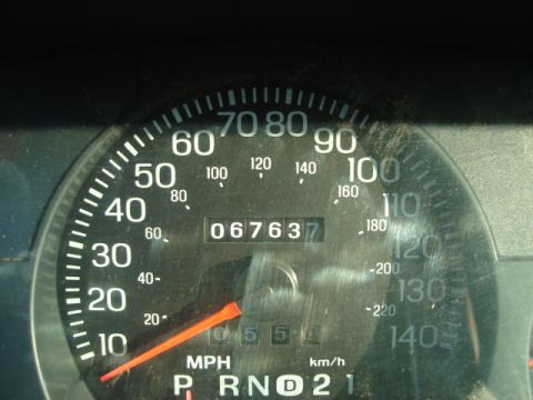 1992 Ford Crown Victoria - Close-up of a car's dashboard gauge cluster, displaying the speedometer and odometer readings.