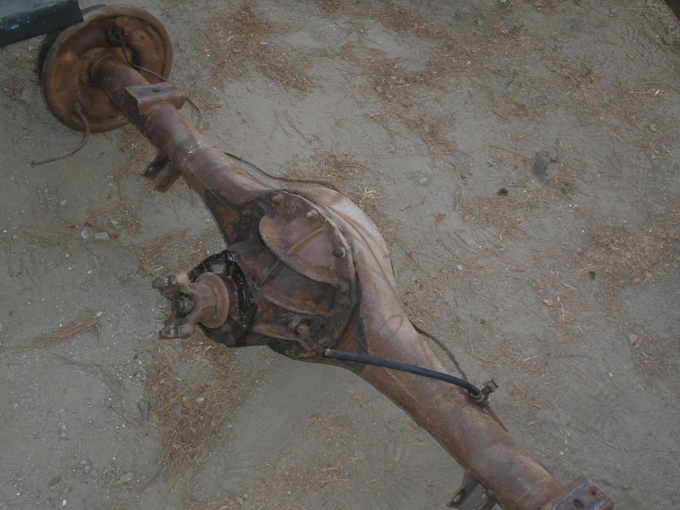 Rear axle assembly on dirt ground