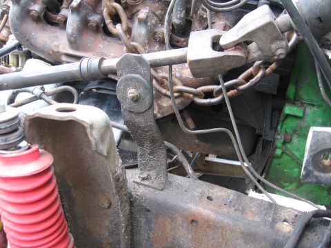 1974 Ford F-100 - Detail view of engine and suspension components, showing rust and wear on various metal parts.