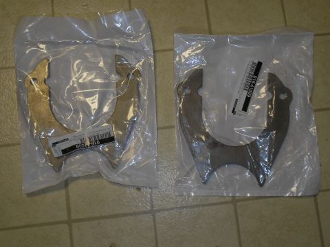 1990 Ford Bronco - Two new metal brackets packaged for sale, one with part number 916-41009 visible.