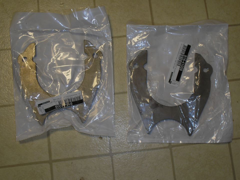 Two metal brackets, each in a clear plastic bag. Part number 916-41009 visible on one label