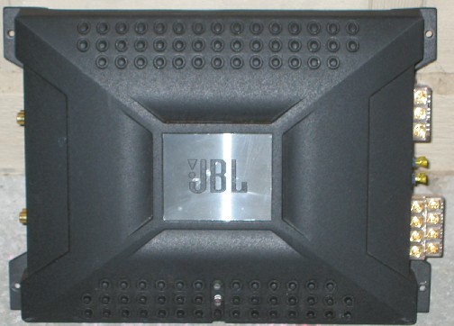 Face-on view of a black JBL car amplifier with brushed logo plate and gold terminals