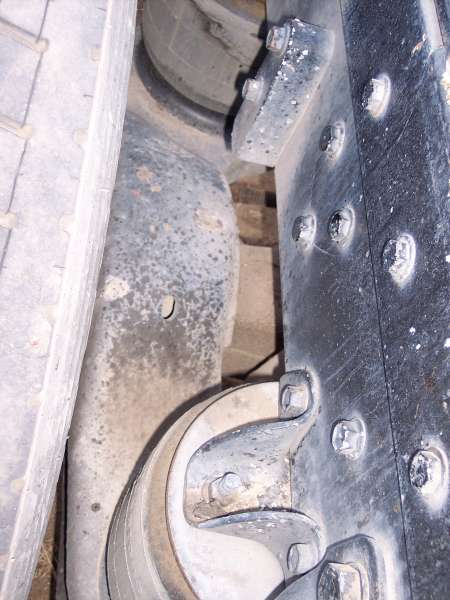 1981 Kenworth W900A - Close-up view of truck chassis parts, showing suspension and frame elements.