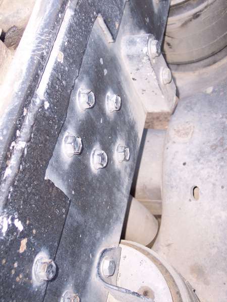 1981 Kenworth W900A - Detail of a bolted bracket on the frame of a heavy-duty truck, likely part of the suspension system.