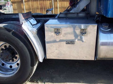 1981 Kenworth W900A - A close-up of a truck's side, revealing a polished metal toolbox and a large fuel tank.