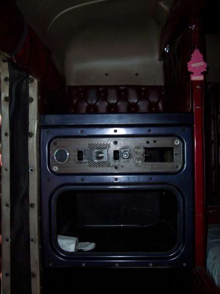 1981 Kenworth W900A - Interior view of a truck's dashboard, showing an empty radio slot and a storage area below.