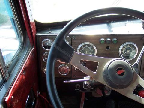 1981 Kenworth W900A - View of the dashboard and steering wheel inside a truck cab.